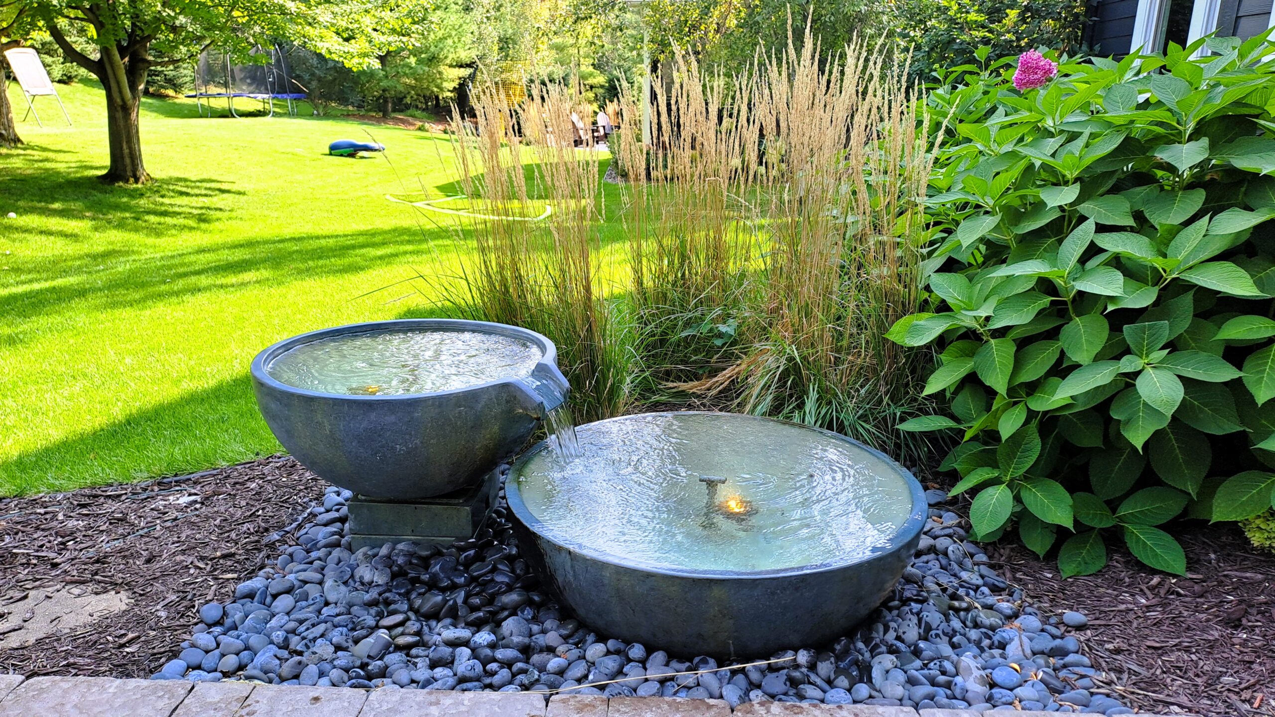 20240911_151643 Dual Aquascape spillway bowls installed in a modern backyard landscape in Woodbury, Minnesota