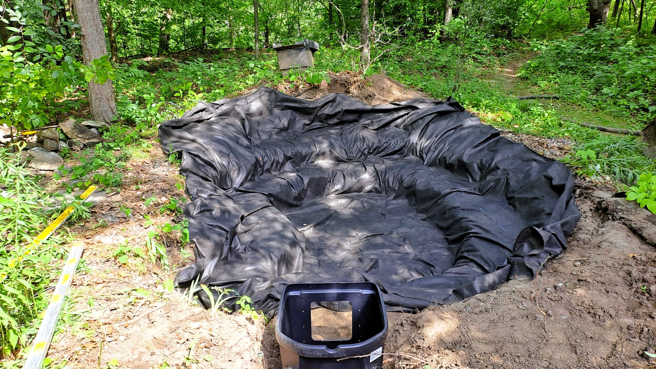EPDM liner installation over underlayment in reconstructed pond in Chaska, Minnesota
