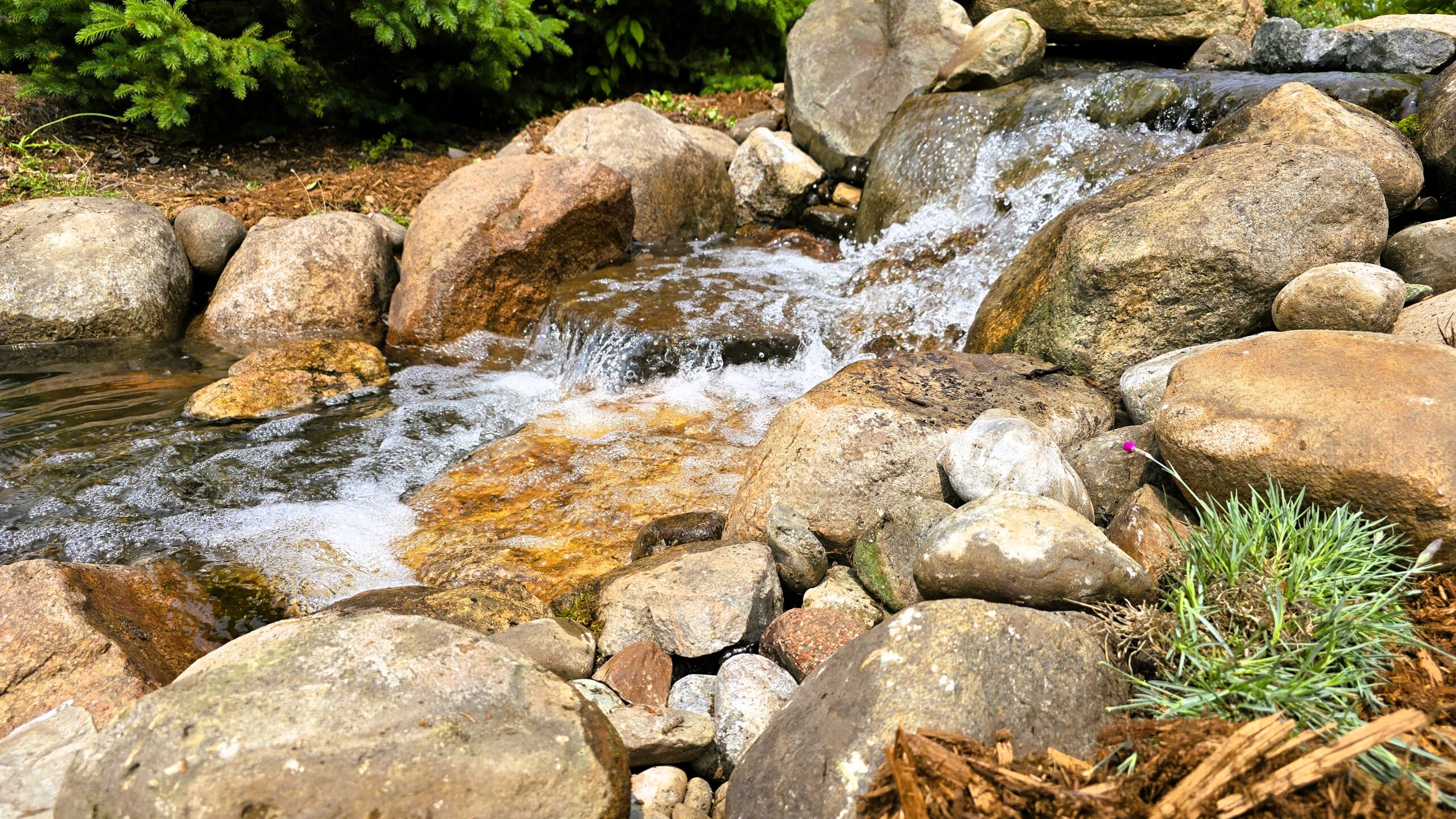 Pondless waterfall reconstruction project McAllister MN