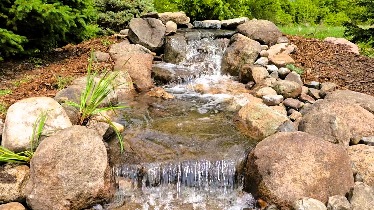 Pondless waterfall reconstruction project McAllister MN