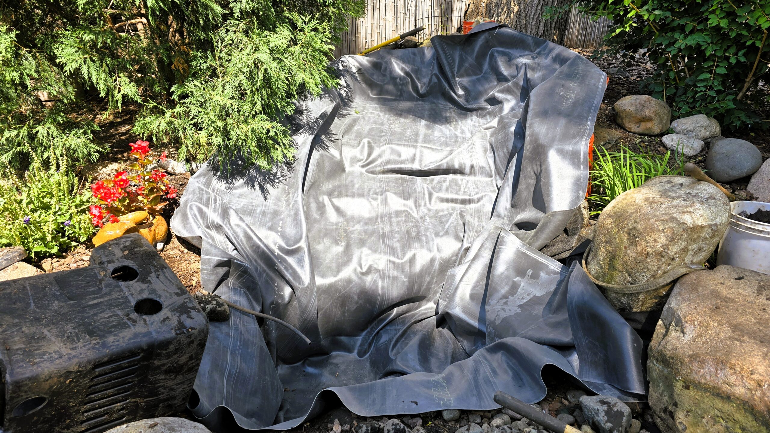 Installation of new one-piece liner for pondless waterfall basin and stream in Hopkins Minnesota