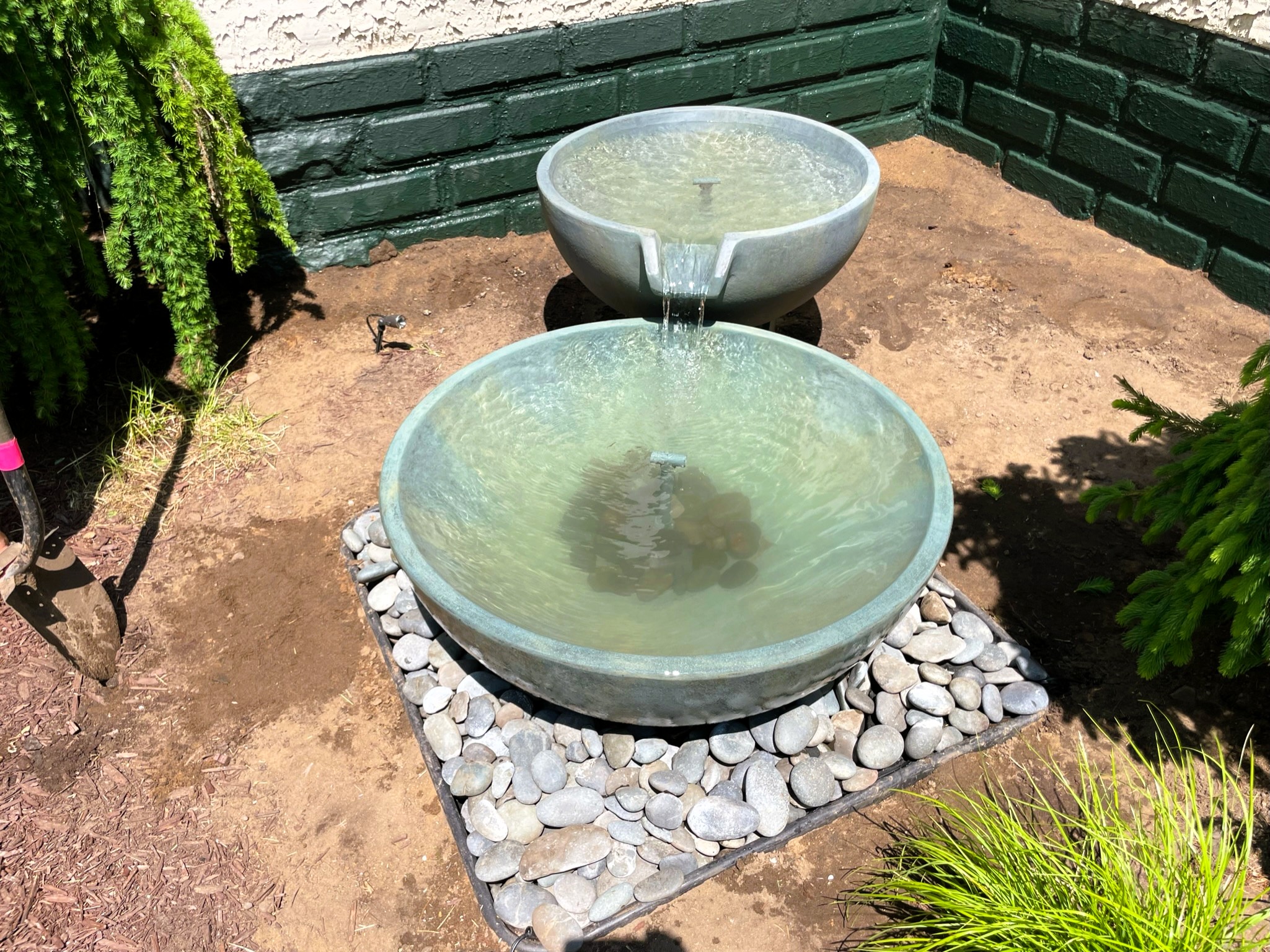 Completed Aquascape spillway bowl fountain with running water in Elk River Minnesota
